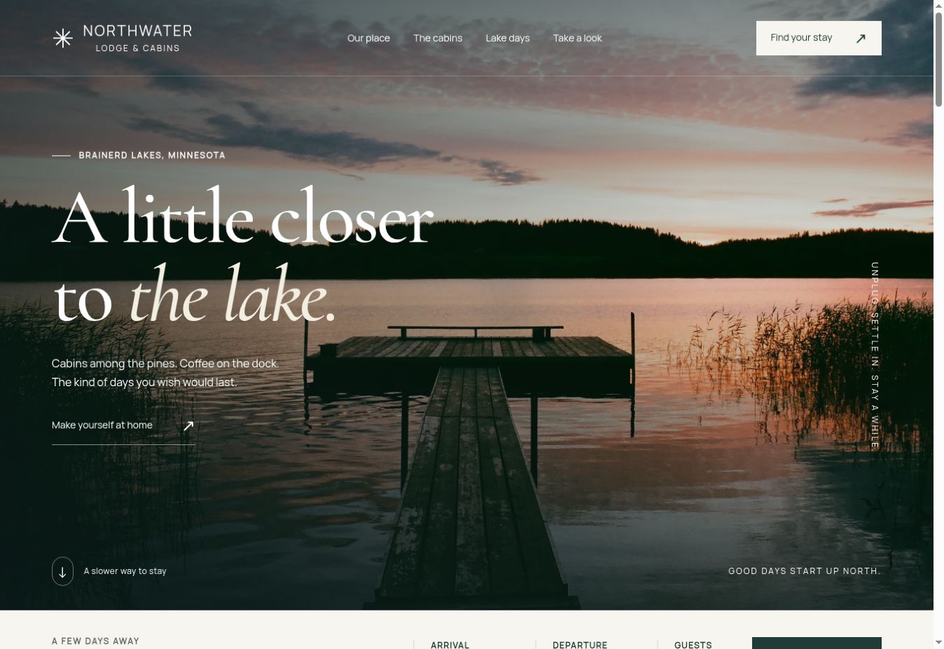 The Northwater Lodge homepage: a sunset over the lake with a dock leading into the photograph, oversized serif lettering, and a link to explore the cabins
